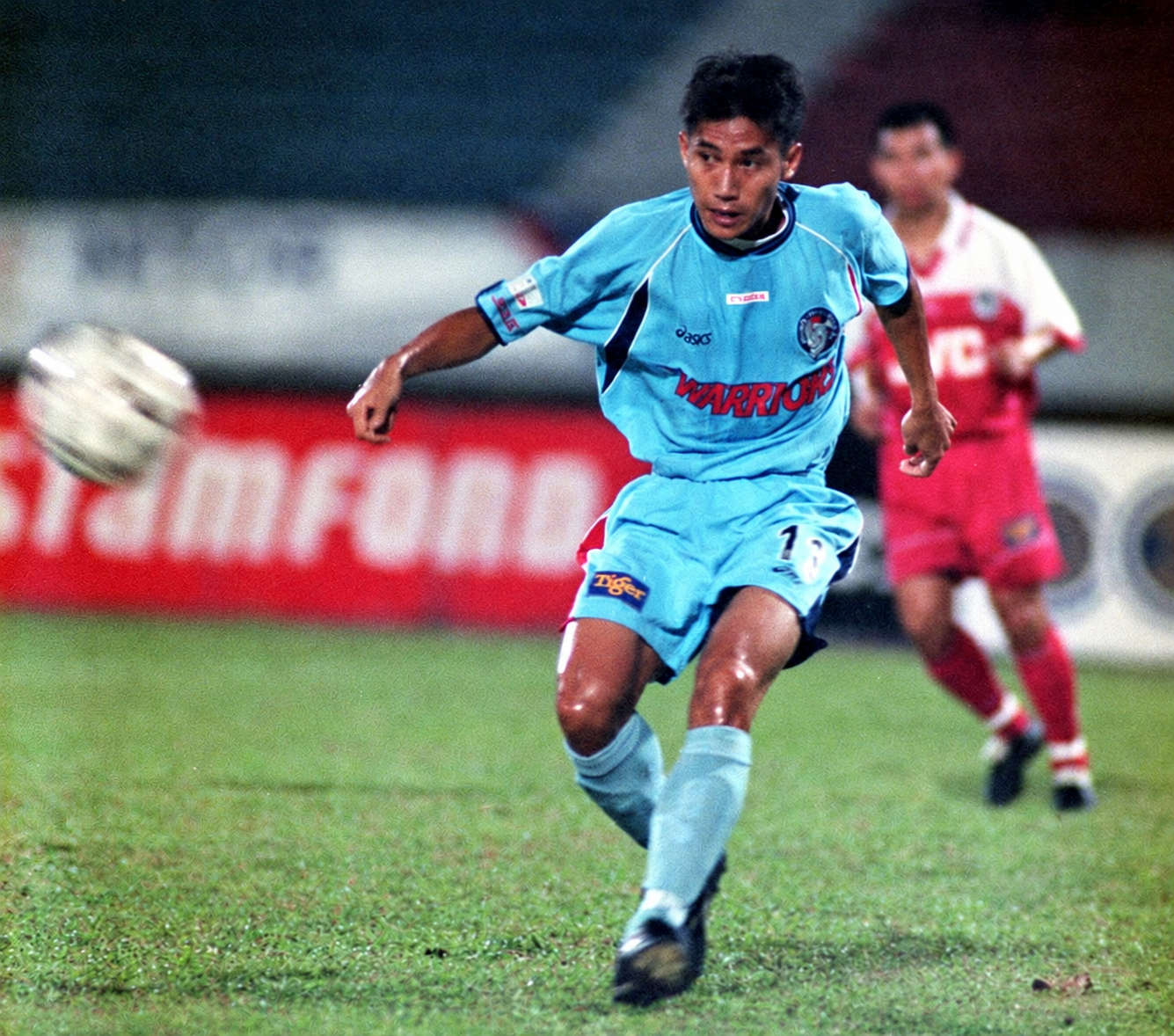 Coach Hafizat Jauharmi playing football in a blue kit